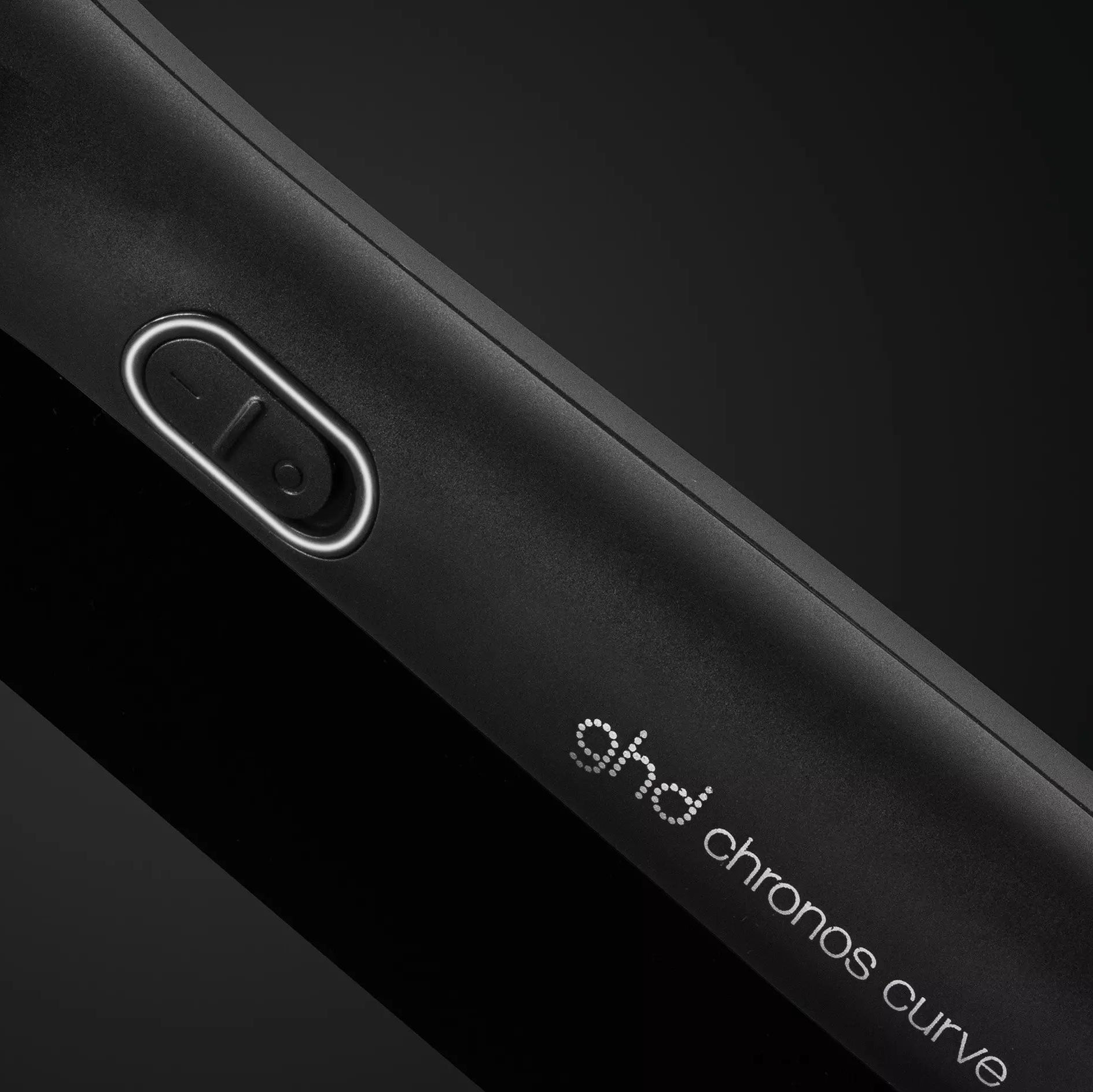 Close up of bower button f ghd Chronos Curve Conical Wand 