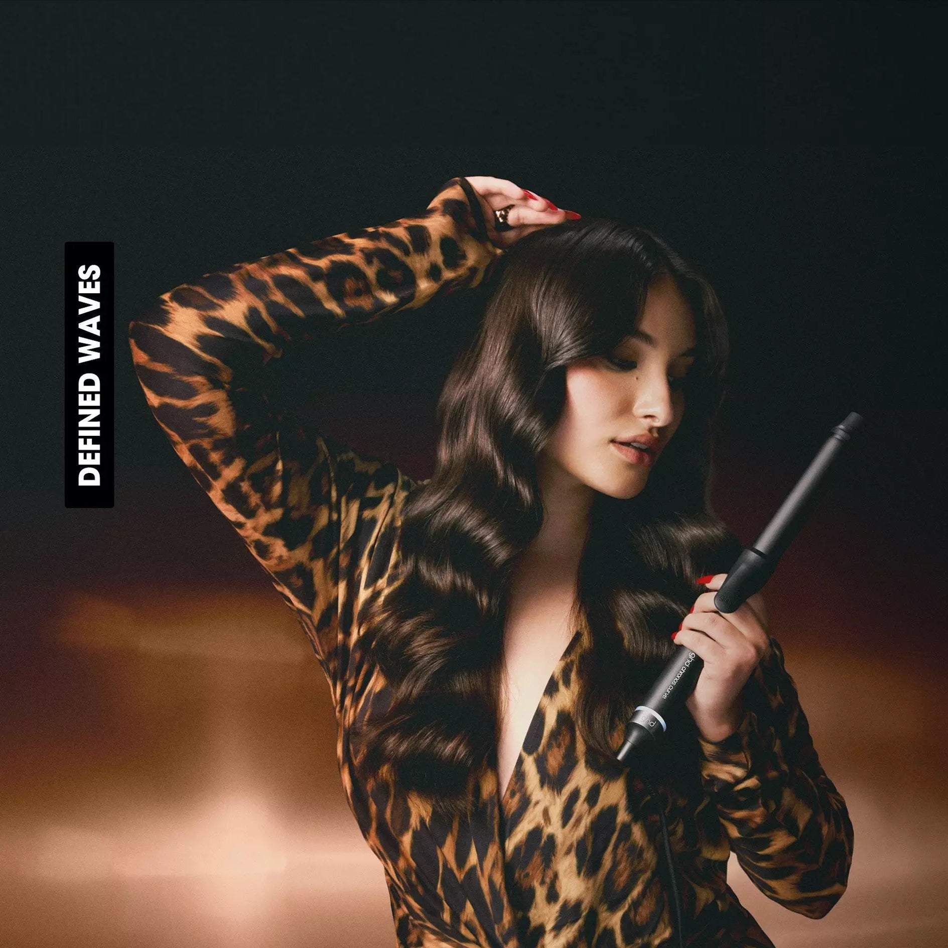 Model holding ghd Chronos Curve Classic Tong (26mm Barrel)