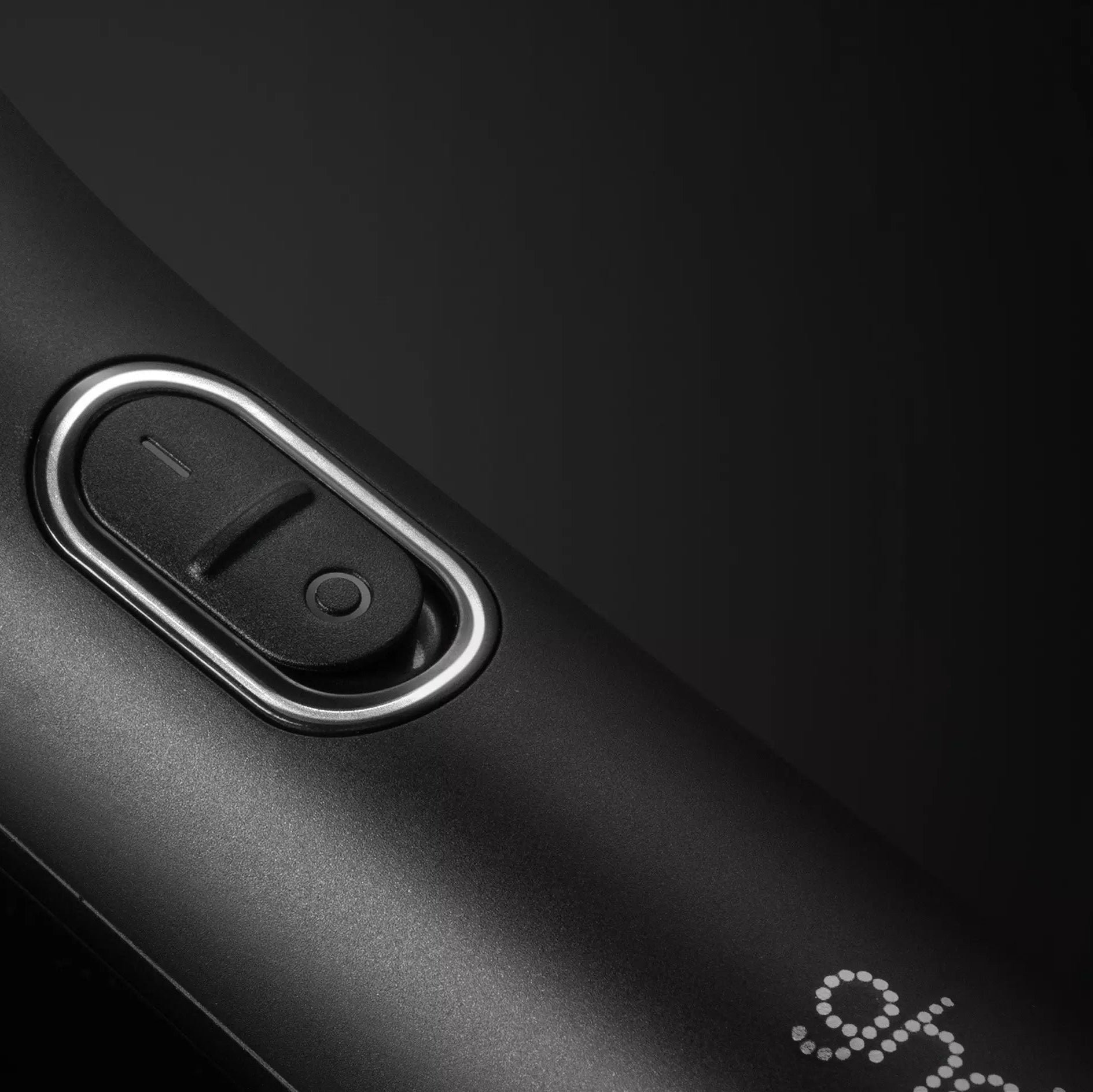 Close up of power button of ghd Chronos Curve Grand Tong 