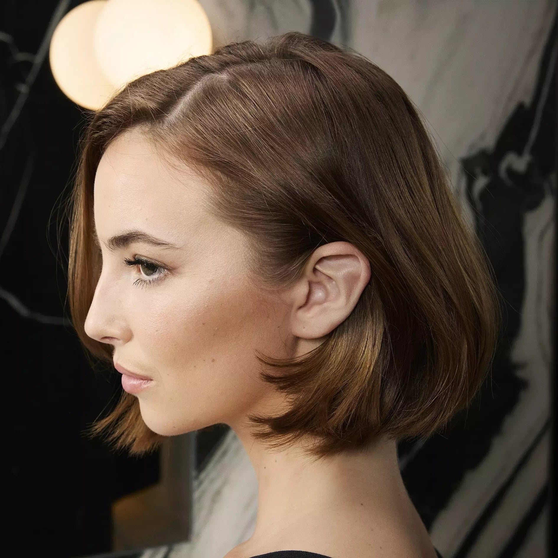 Model who has used ghd Rehab Fine Hair Thickener Spray 95ml on hair
