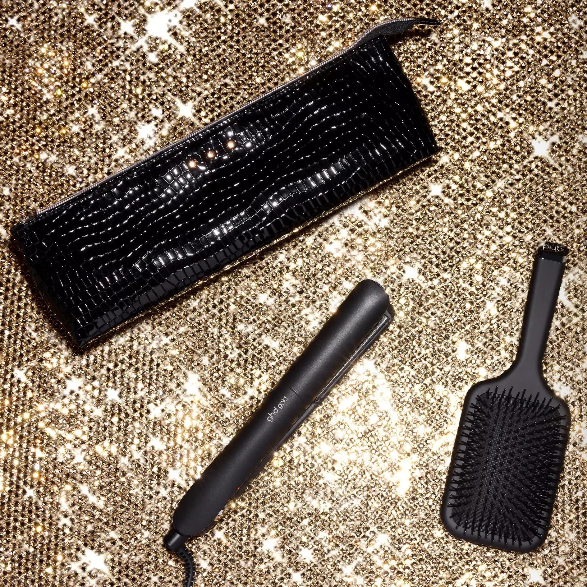 ghd Gold Hair Straightener Gift Set on gold background