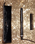 ghd Chronos Curve Conical Wand Christmas Gift Set opened on a gold sparkly background
