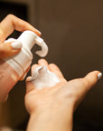 Model dispensing Instalash Lash & Foam Cleansing Foam with Eyelash Conditioner