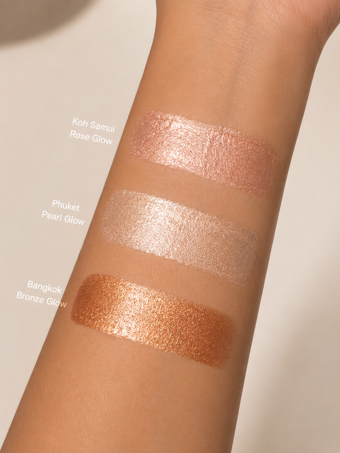 Dominic Paul Liquid Highlighter  swatches on model's arm