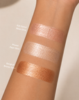 Dominic Paul Liquid Highlighter  swatches on model's arm
