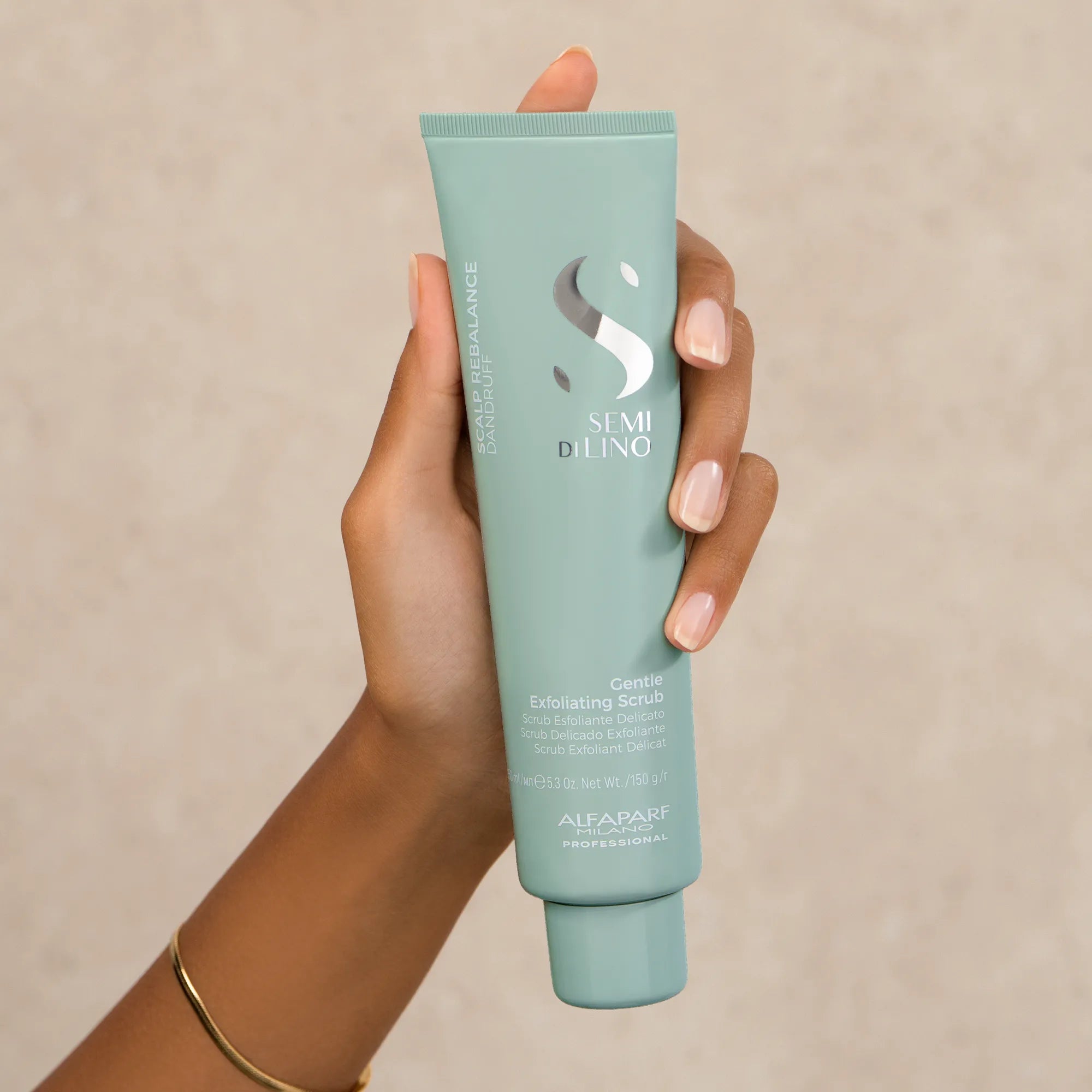 Model holding Alfaparf Milano Semi Di Lino Scalp Gentle Exfoliating Scrub 