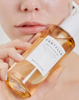Model holding Skin1004 Madagascar Centella Light Cleansing Oil