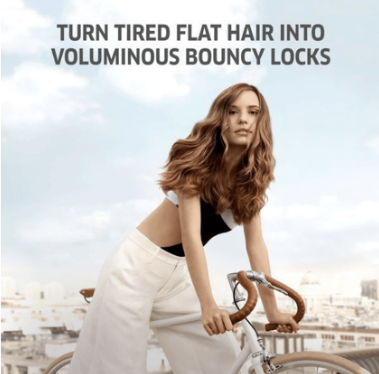 Model with bouncy hair after using Wella Invigo Volume Booster