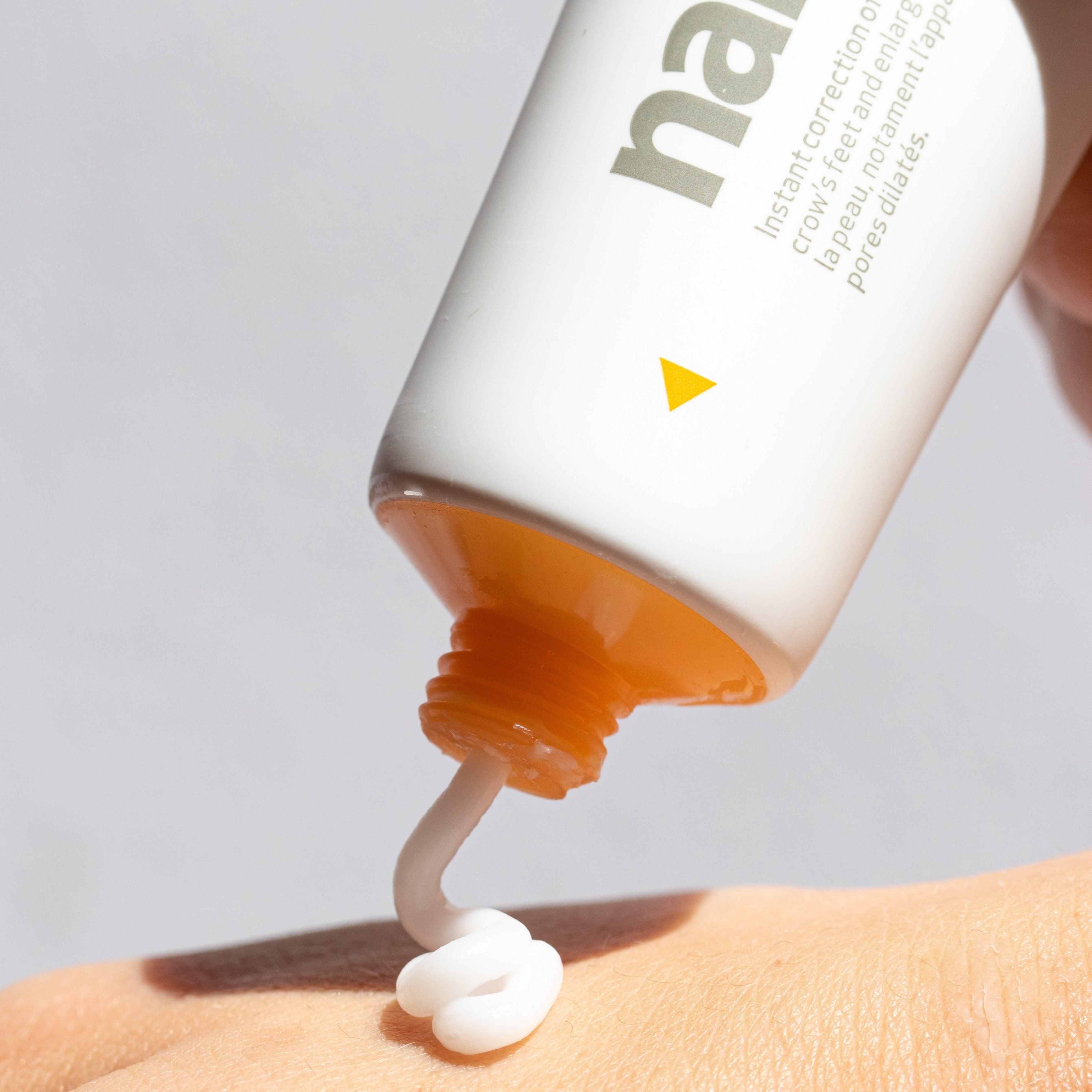 Applying Indeed Labs Nanoblur to the back of the hand