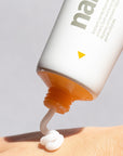 Applying Indeed Labs Nanoblur to the back of the hand
