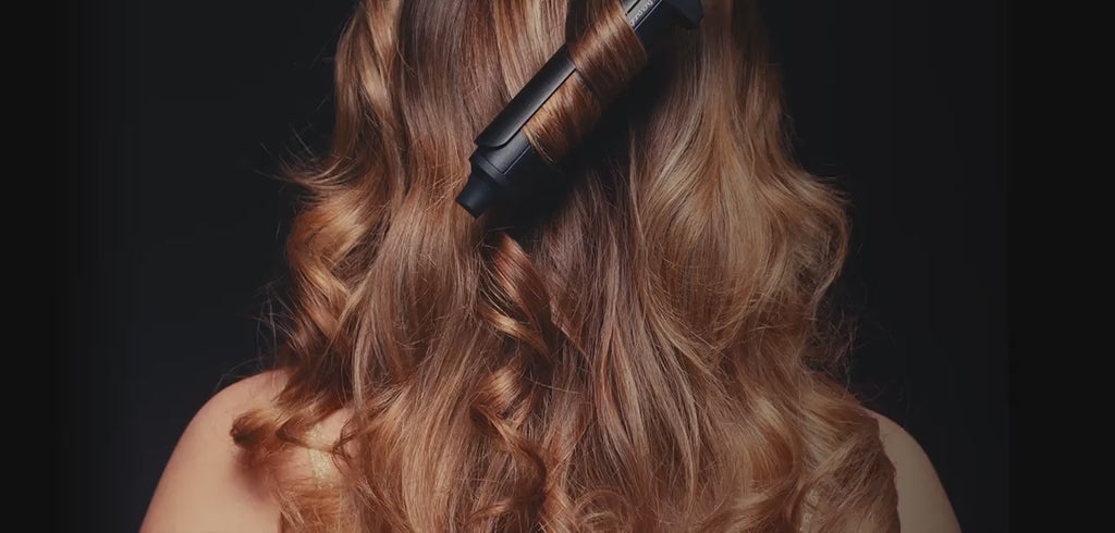 Using the ghd Chronos Curve Grand Tong (32mm Barrel) to curl a redhead's hair