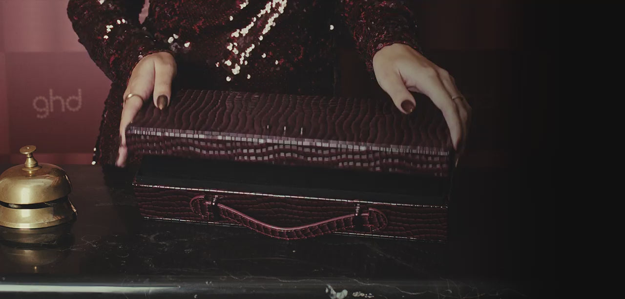 Model opening ghd Cherry Chic Gold Hair Straightener Gift Set 