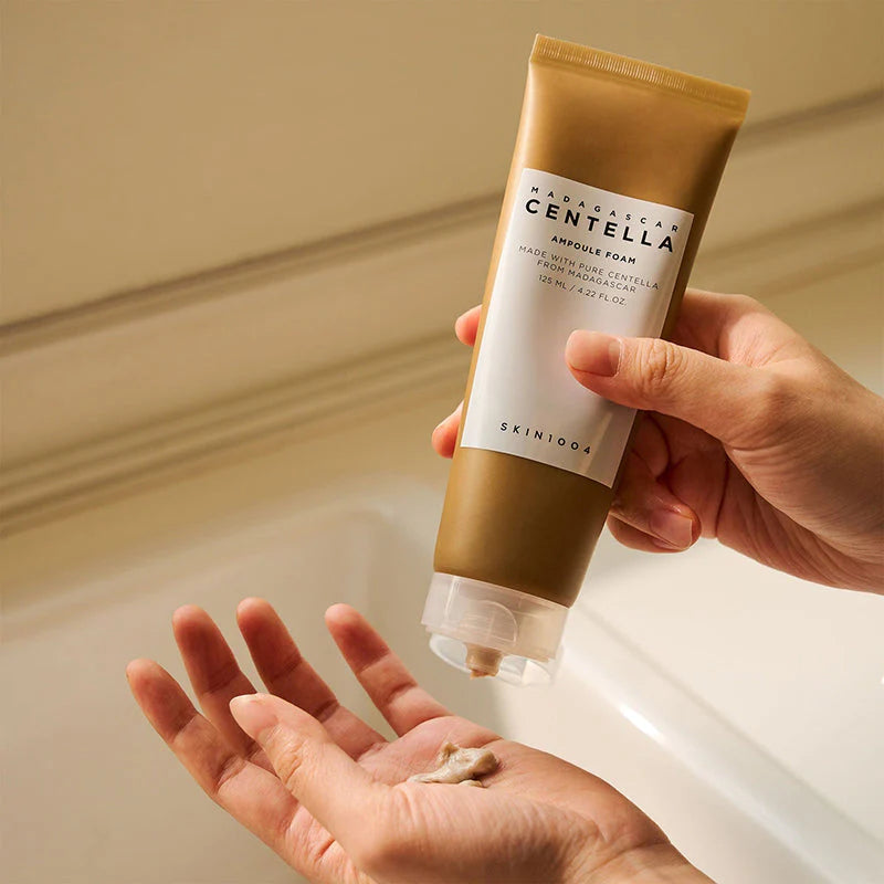 Model applying Skin1004 Centella Ampoule Foam to hand