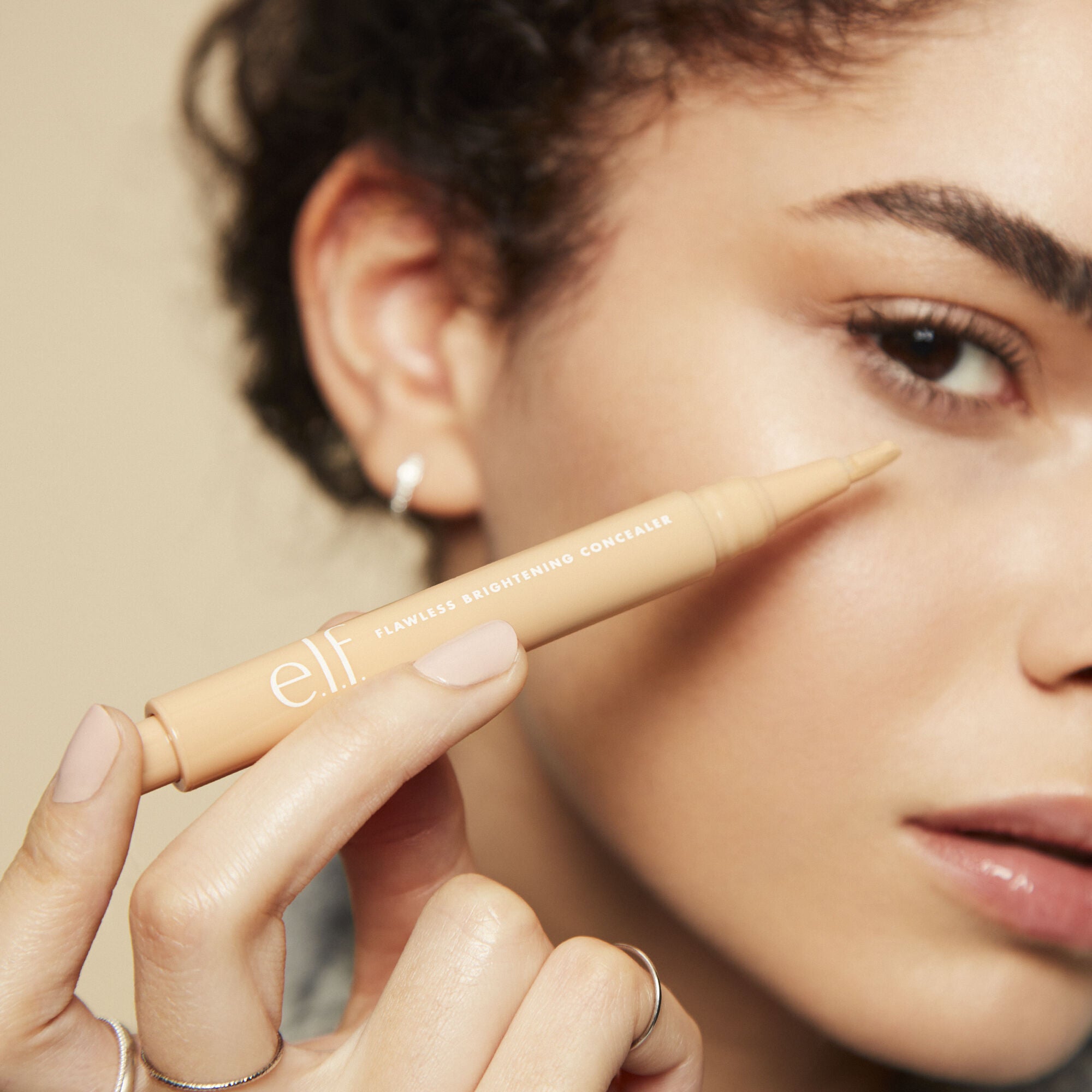 Model using elf Flawless Brightening Concealer