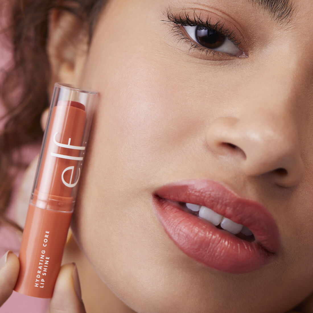 Model using elf Hydrating Core Lip Shine