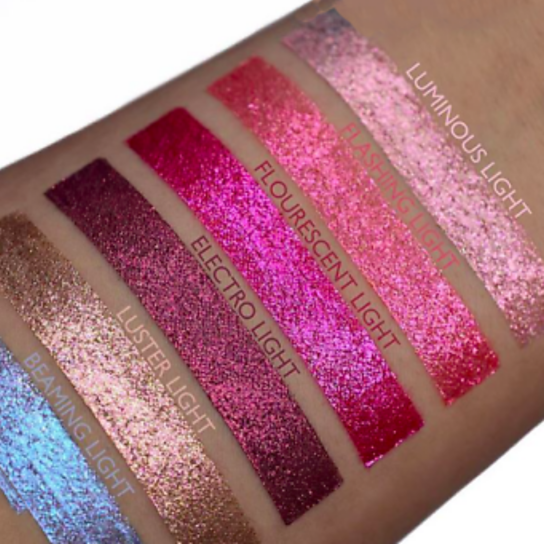 MILANI HYPNOTIC LIGHTS LIP TOPPER swatches on model's arm