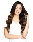 Model wearing Beauty Works 20" Deluxe Remy Instant Clip-In Extensions