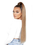 Model wearing Beauty Works 26" Invisi-Ponytail Super Sleek, side view