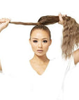 Model installingBeauty Works 20" Invisi-Ponytail Beach Wave