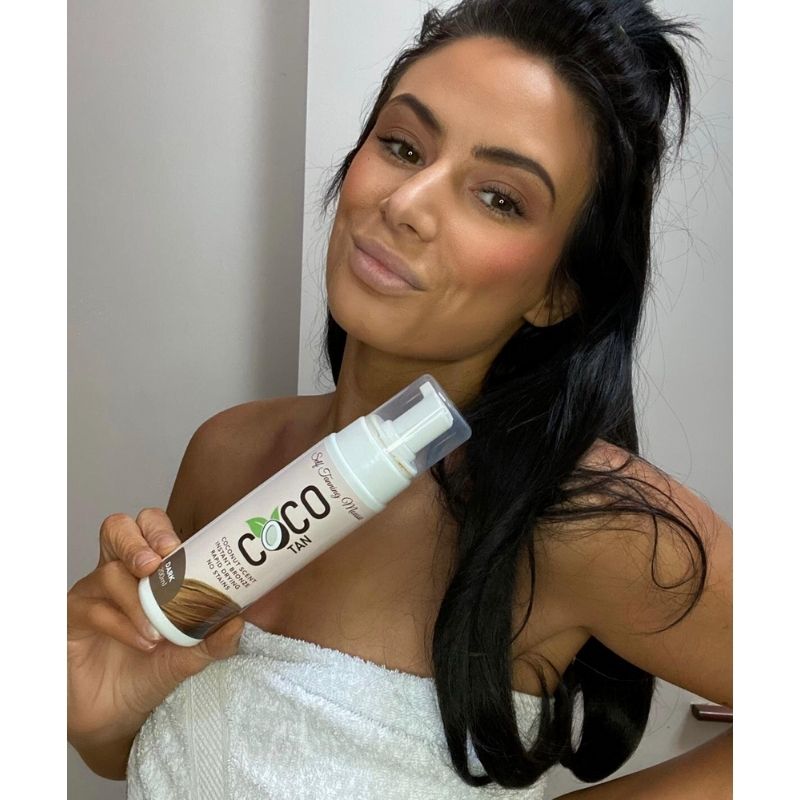 Model holding COCO TAN Self Tanning Mousse