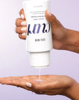 Model holding Color Wow Snag-Free Pre-Shampoo Detangler