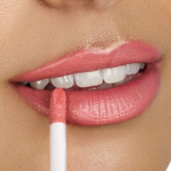 Model wearing Dominic Paul Lip Glaze - Orchid