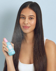 Model holding HAIRBURST Volume & Growth Elixir