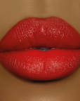 Model wearing DOLL BEAUTY Doll Lipstick - Red Between The Lines