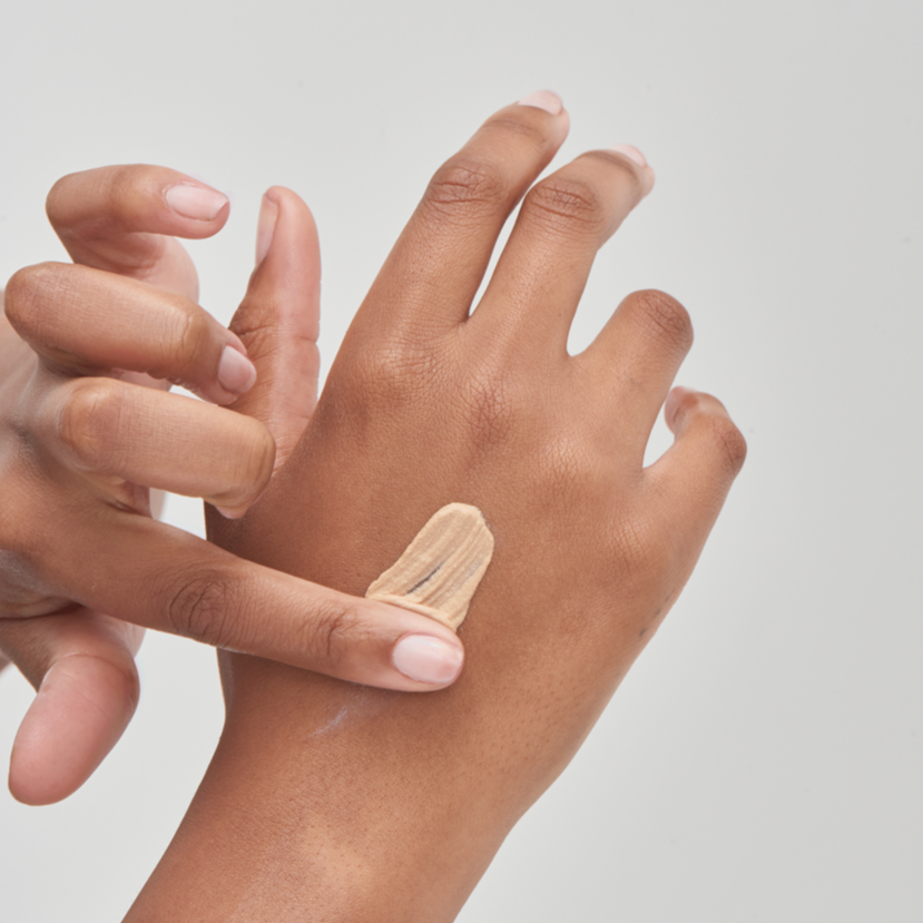 The Inkey List SPF 30 Daily Sunscreen on model's hand