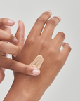 The Inkey List SPF 30 Daily Sunscreen on model's hand