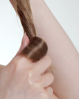 Model using The INKEY List Shea Oil Nourishing Hair Treatment