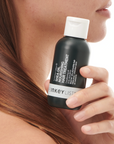 Model who has used The INKEY List Shea Oil Nourishing Hair Treatment for healthy, strong hair