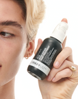 Model holding The INKEY List PCA Bond Repair Hair Treatment