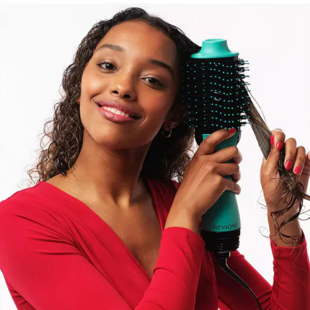 Model using Revlon One-Step Hair Dryer And Volumizer 