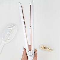 Model holding BEAUTY WORKS X MOLLY-MAE HAIR STRAIGHTENER 